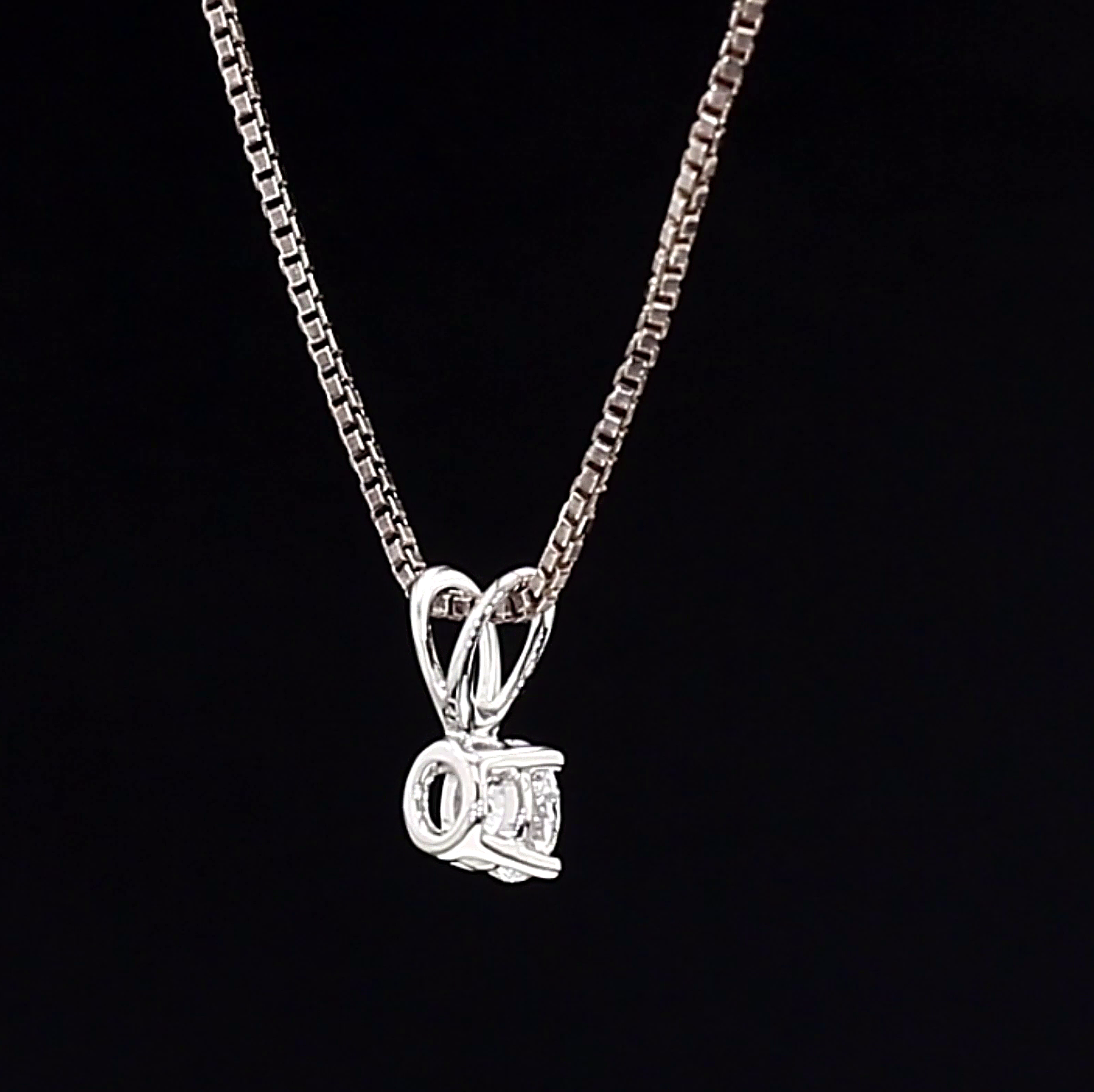 Gold White necklace with a pendant on a black background