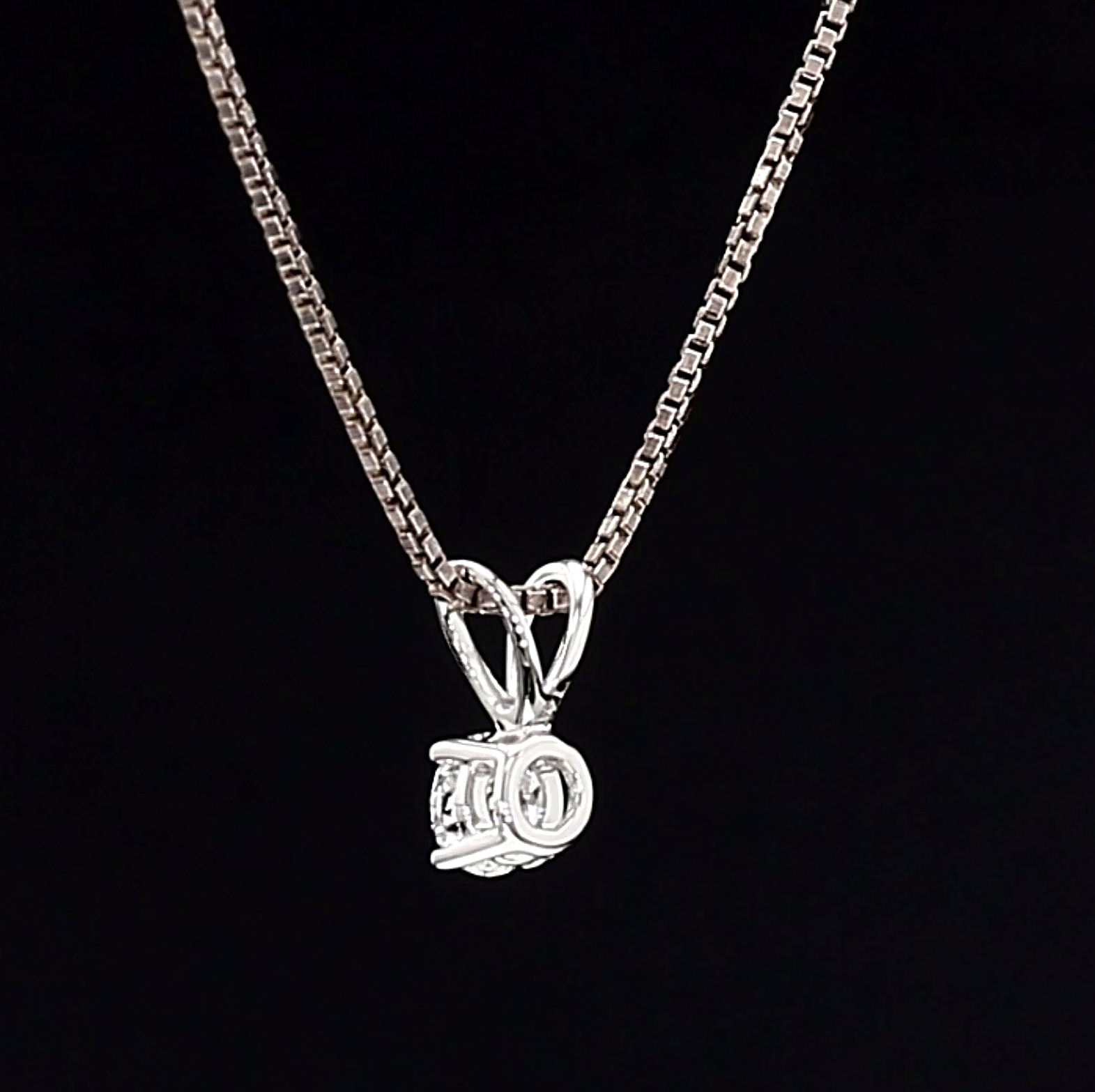 White Gold necklace with a pendant on a black background