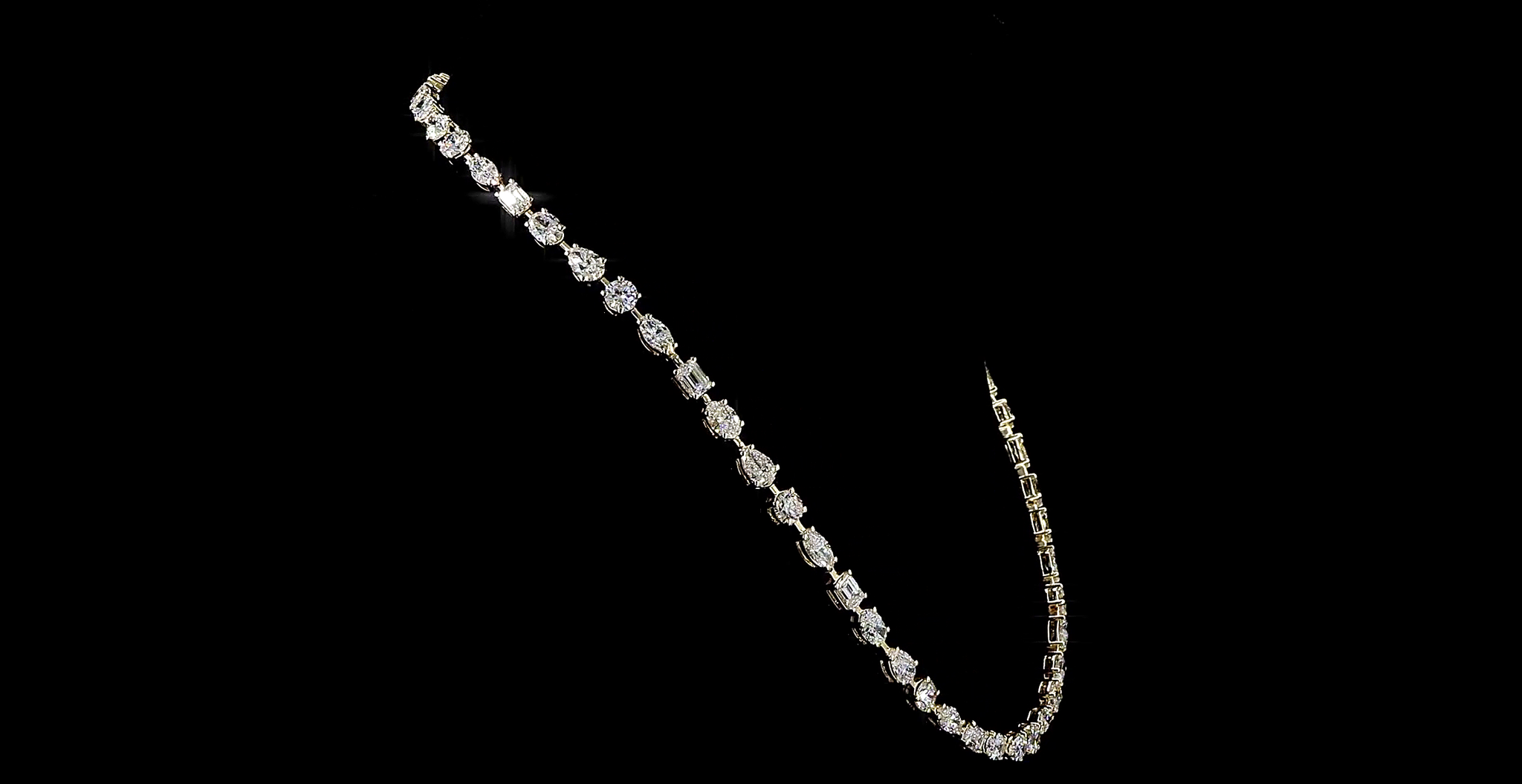 Multi shape Diamond necklace on a black background