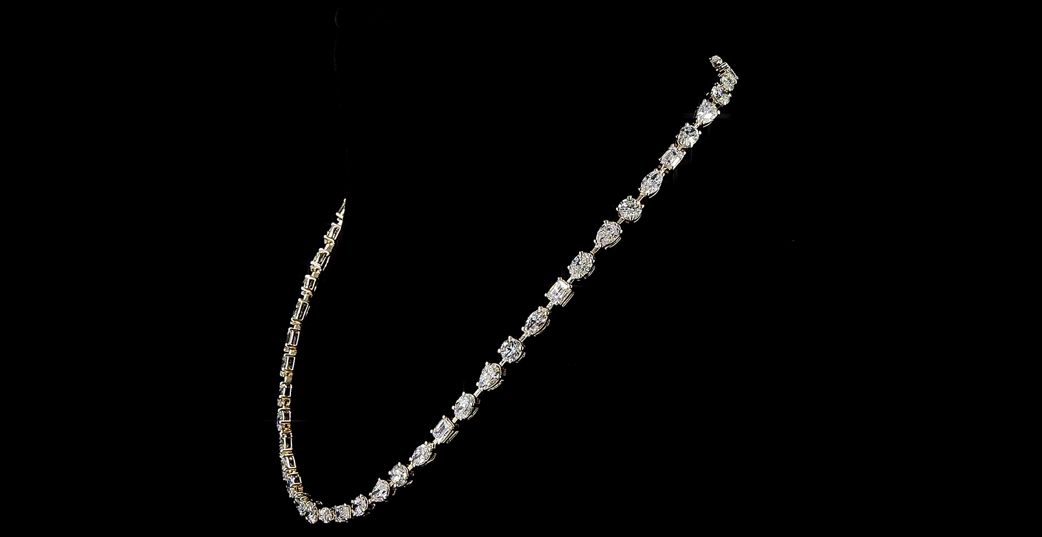 Multi shape Diamond necklace on a black background