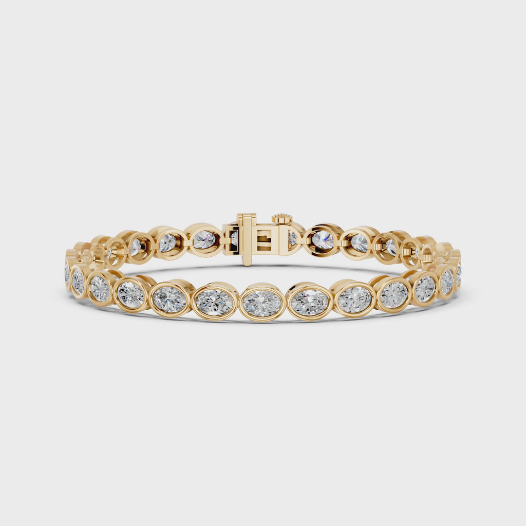 Oval Lab Diamond E-W Bezel Tennis Bracelet in 14K Yellow Gold – video